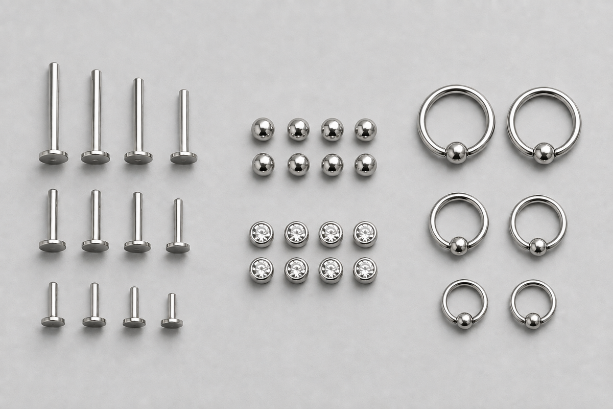 Titanium posts, matching ends and rings grouped by component and size for studio restock planning.