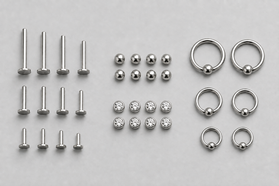 Titanium posts, matching ends and rings grouped by component and size for studio restock planning.