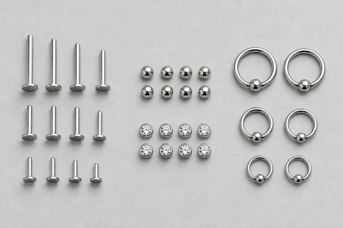 Titanium posts, matching ends and rings grouped by component and size for studio restock planning.