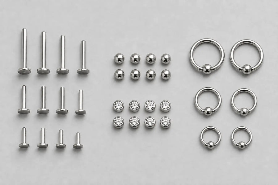 Titanium posts, matching ends and rings grouped by component and size for studio restock planning.