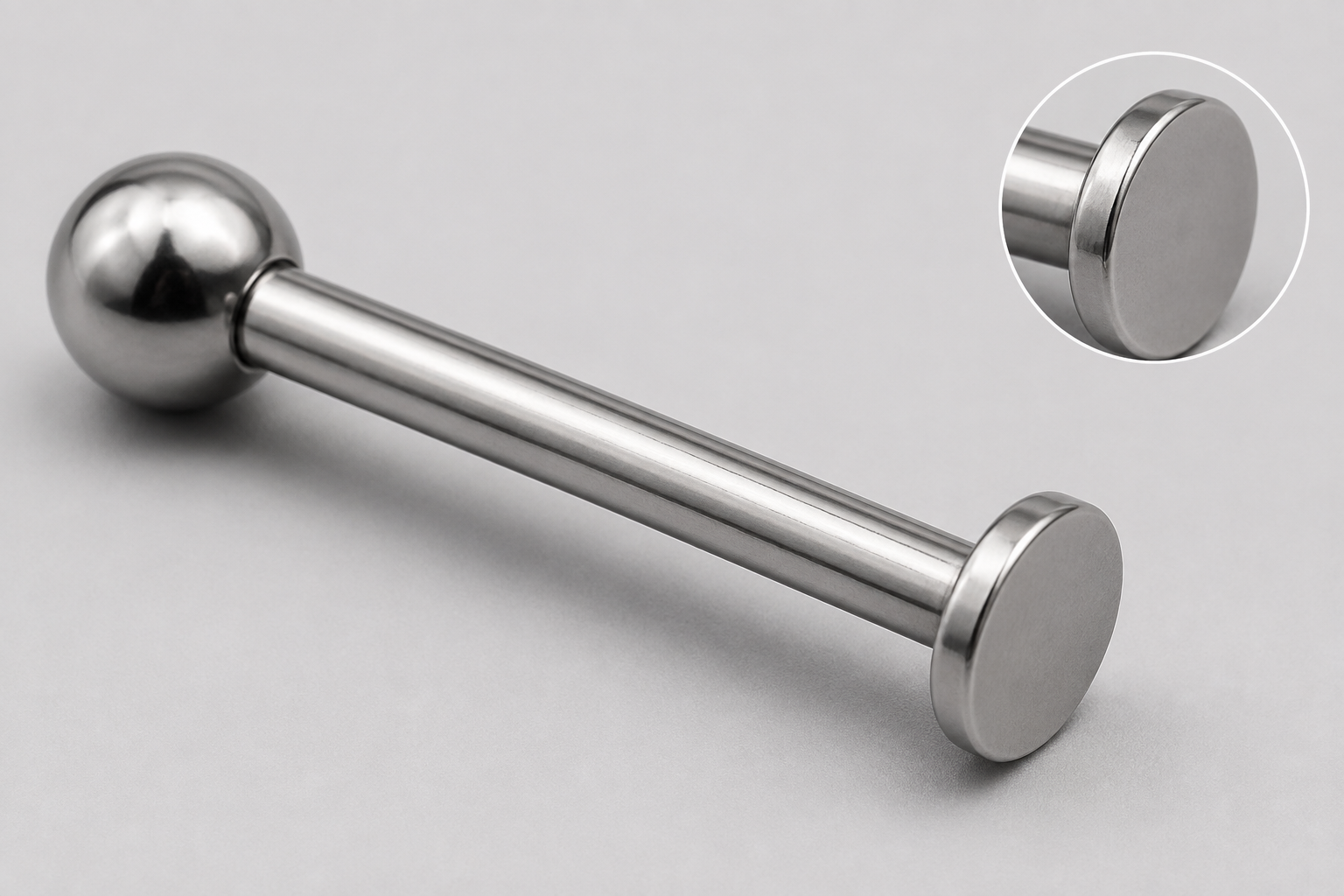 Illustrative full-item and magnified disk-edge views of a titanium labret for documenting a supplier issue.