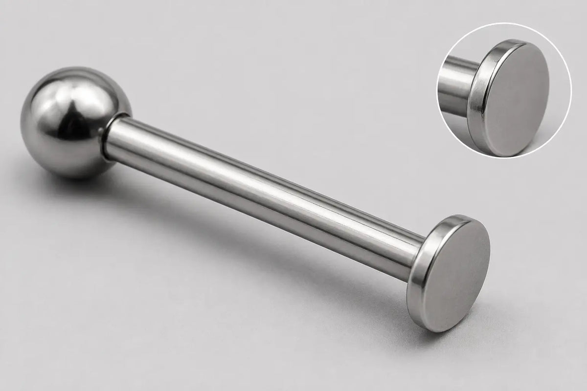 Illustrative full-item and magnified disk-edge views of a titanium labret for documenting a supplier issue.