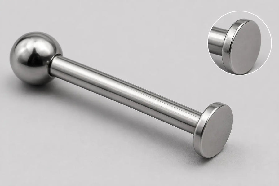 Illustrative full-item and magnified disk-edge views of a titanium labret for documenting a supplier issue.