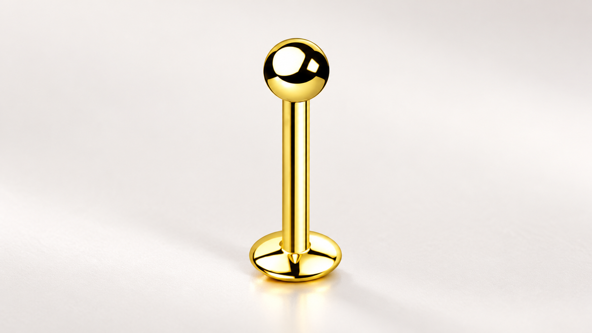 AI illustration of an assembled gold-tone labret with ball end and convex base