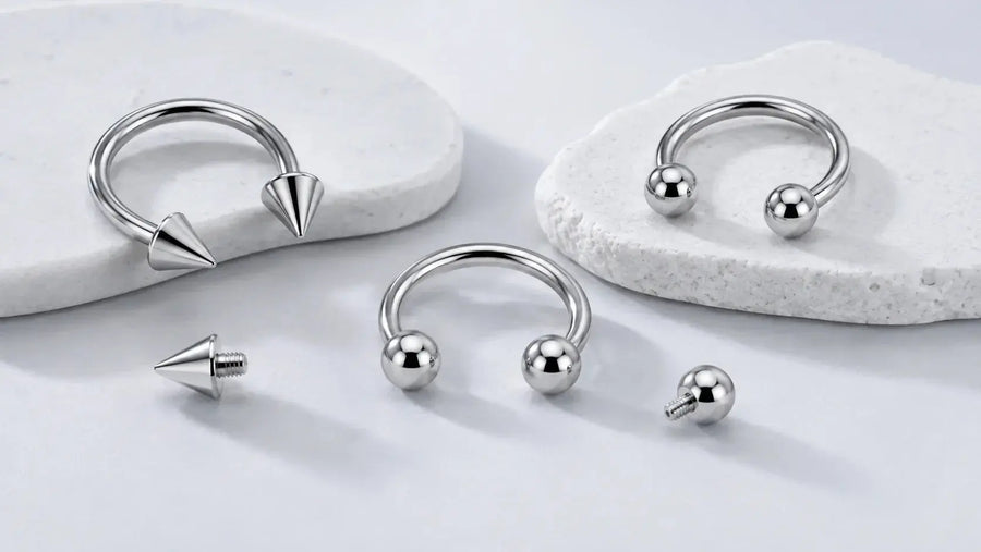 Titanium circular barbells and horseshoe rings with ball and cone ends