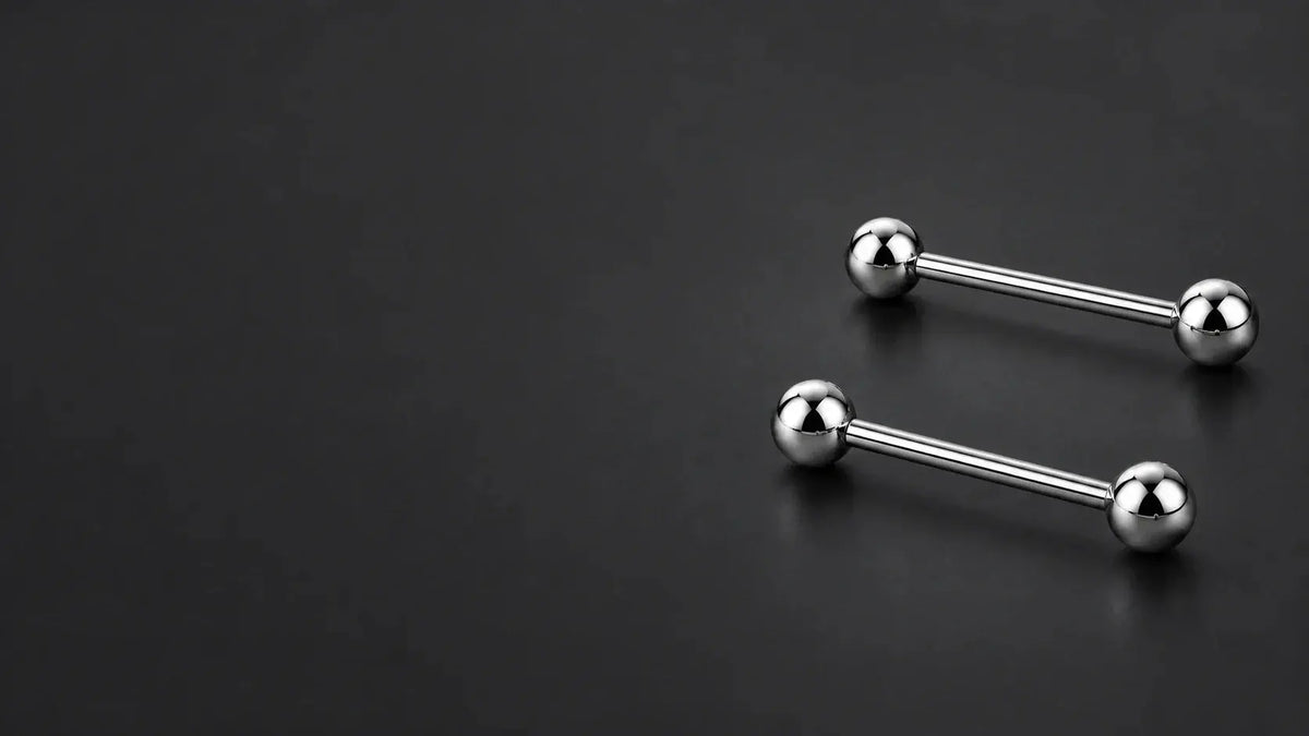 Illustration of two polished titanium straight barbells with plain ball ends