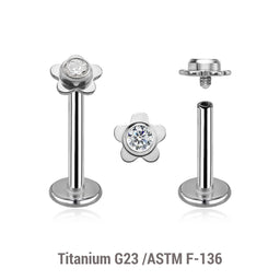 Pack of 5 high polished titanium internally threaded labrets, Thickness 1.2mm, with a top in a flat flower shape with a single bezel set central crystal